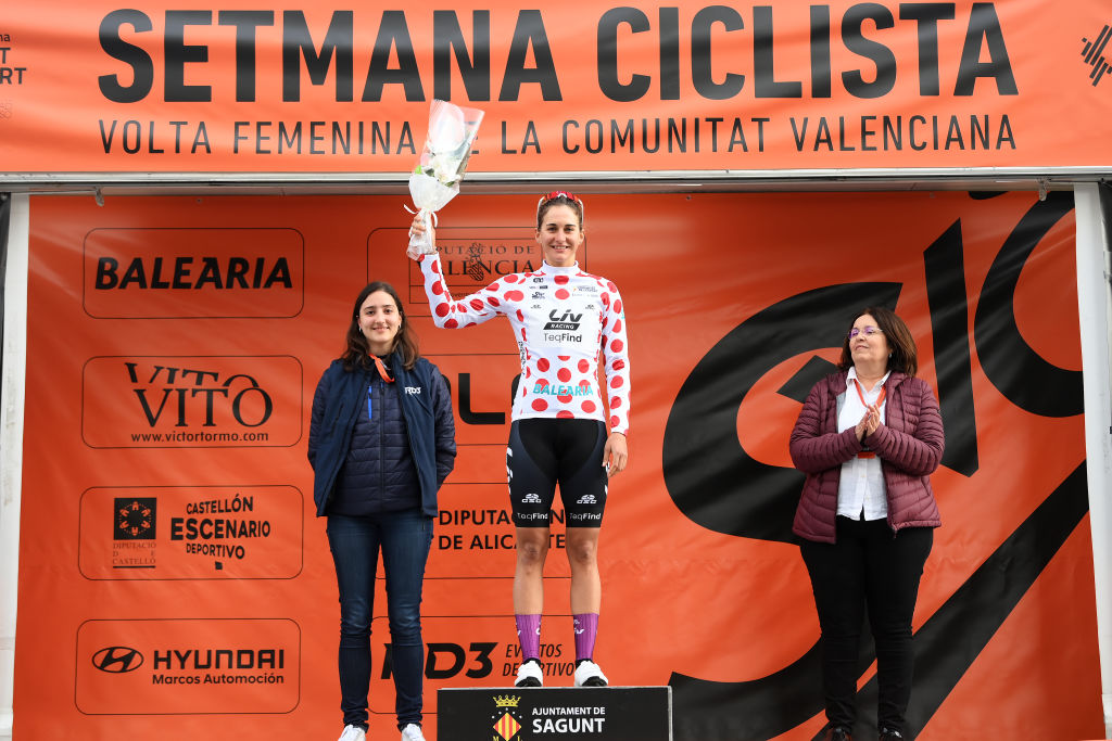 SAGUNT SPAIN FEBRUARY 16 Katia Ragusa of Italy and Team Liv Racing TeqFind celebrates at podium as Polka Dot Mountain Jersey winner during the 7th Setmana Ciclista Volta Comunitat Valenciana Femines 2023 Stage 1 a 119km stage from Valencia to Sagunt on February 16 2023 in Sagunt Spain Photo by Alex BroadwayGetty Images