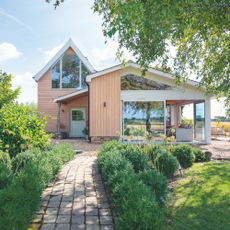 farmhouse with modern extension decorated in shades of grey and white