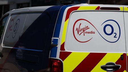 Virgin Media O2 logo and branding pictured on the back of a utility van. 