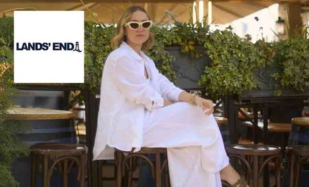 lands end logo placed over a woman posing in all white sitting in an outside bar 