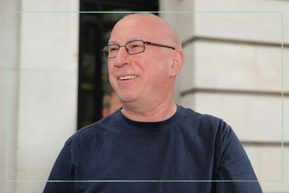 a close up of Ken Bruce smiling outside BBC Broadcasting house