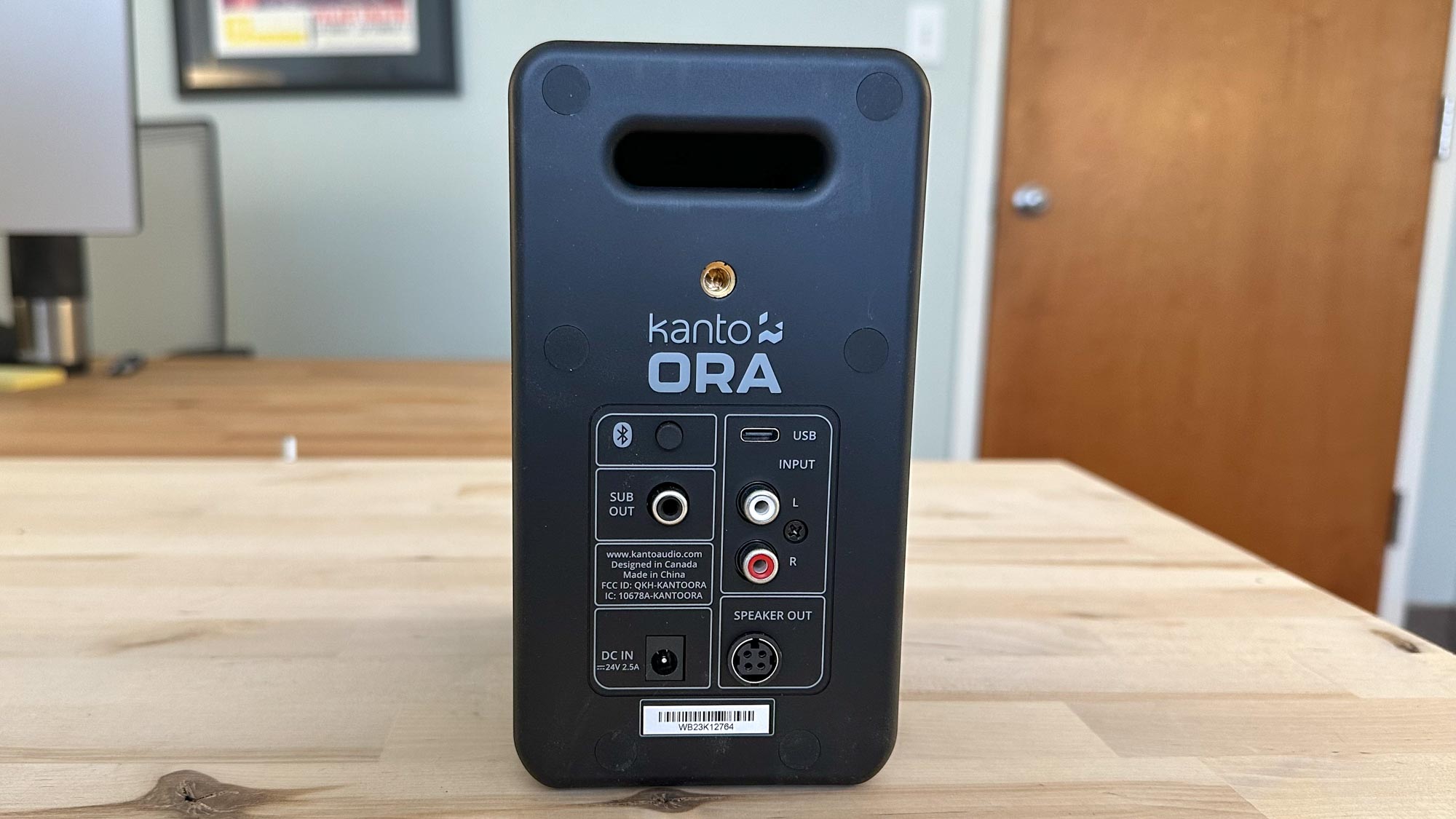 Kanto Ora image showing back of speaker connectivity and bass reflex port