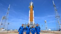 NASA astronauts Reid Wiseman, Artemis II commander, left, Victor Glover, Artemis II pilot, Christina Koch, Artemis II mission specialist, and CSA (Canadian Space Agency) astronaut Jeremy Hansen, Artemis II mission specialist, right, stop for a group photograph as they visit NASA’s Artemis II SLS (Space Launch System) rocket and Orion spacecraft, Monday, March 30, 2026, at Launch Complex 39B of NASA’s Kennedy Space Center in Florida.