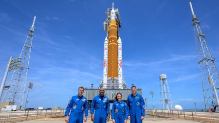 NASA astronauts Reid Wiseman, Artemis II commander, left, Victor Glover, Artemis II pilot, Christina Koch, Artemis II mission specialist, and CSA (Canadian Space Agency) astronaut Jeremy Hansen, Artemis II mission specialist, right, stop for a group photograph as they visit NASA&rsquo;s Artemis II SLS (Space Launch System) rocket and Orion spacecraft, Monday, March 30, 2026, at Launch Complex 39B of NASA&rsquo;s Kennedy Space Center in Florida. 