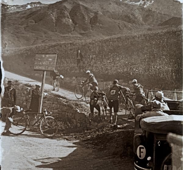 Riders climbing a mountain in the 1930 Tour had only two gears. They had to physically stop and remove their rear wheel and turn it around to engage the gear/cog on the other side of the wheel. This is Route N91, climbing the Col de Lautaret from Grenoble during the 16th stage of the Tour from Grenoble to Evian. The mammoth 331km stage was won by Tour leader Andr&eacute; Leducq in a time of 13h39'23".