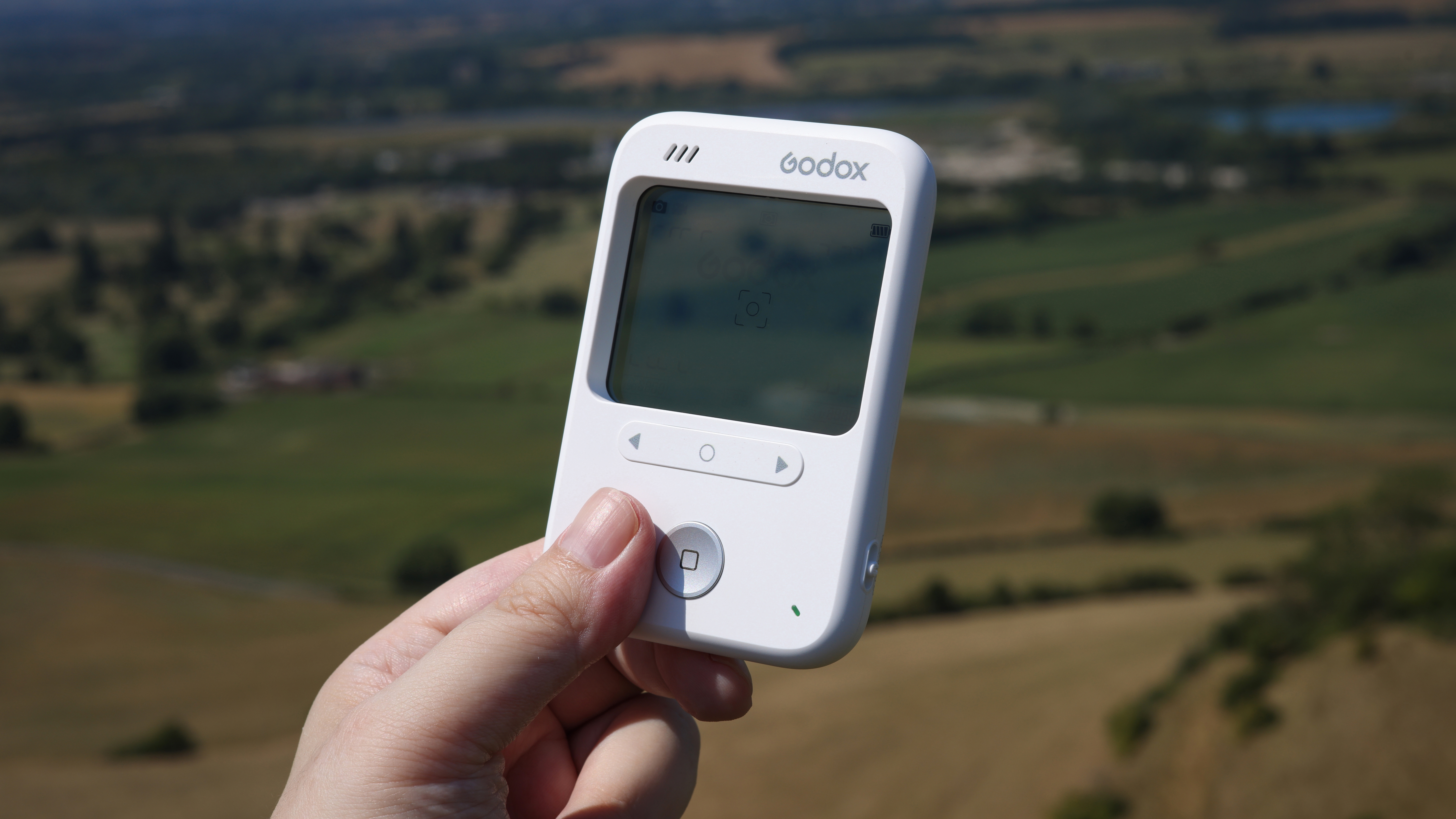 Godox C100 being held outdoors