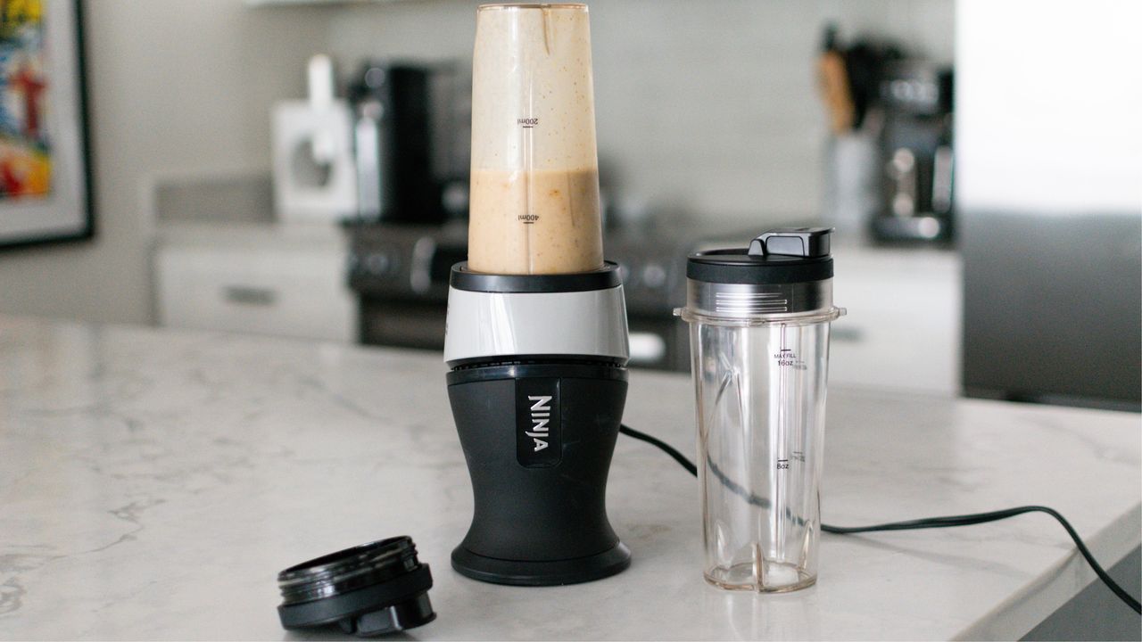 Ninja fit blender with blending cup on white marble countertop in Heather Bien&#039;s kitchen