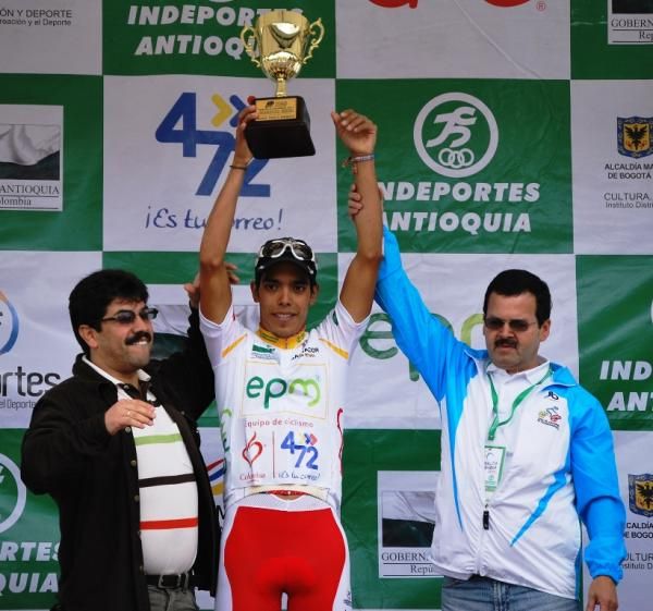 Pantano raises his hands aloft with the trophy for stage seven.