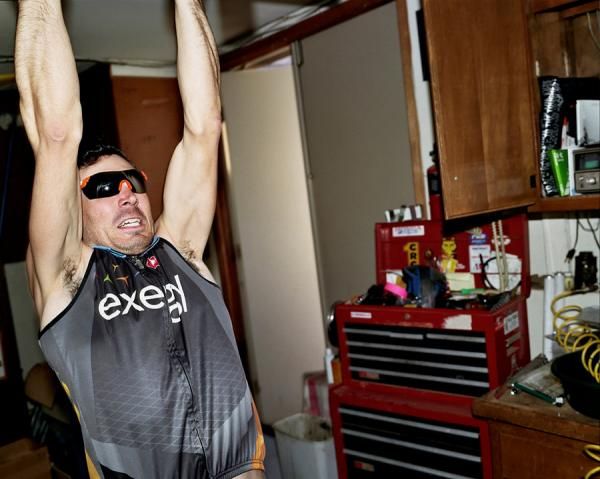 Sam Johnson does a chin-up.