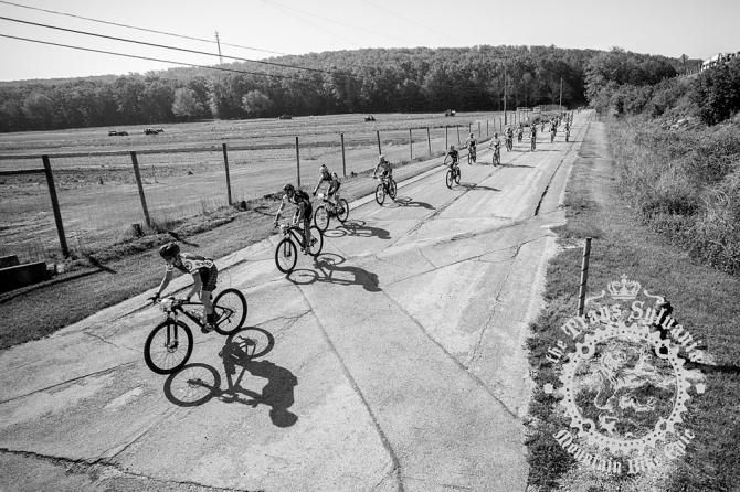 Riders set out from camp to the official start in a neutral pack.