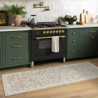 green kitchen with runner rug 