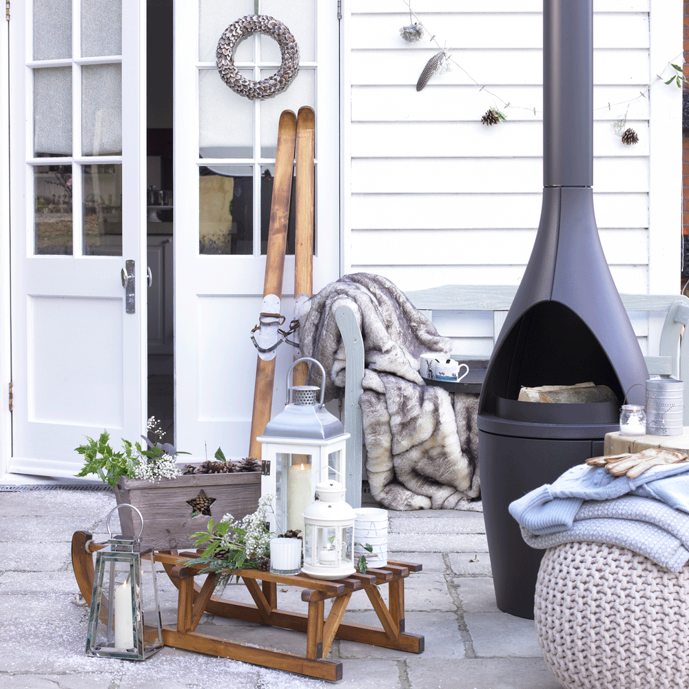 outdoor with white door and candle lamp and barbeques