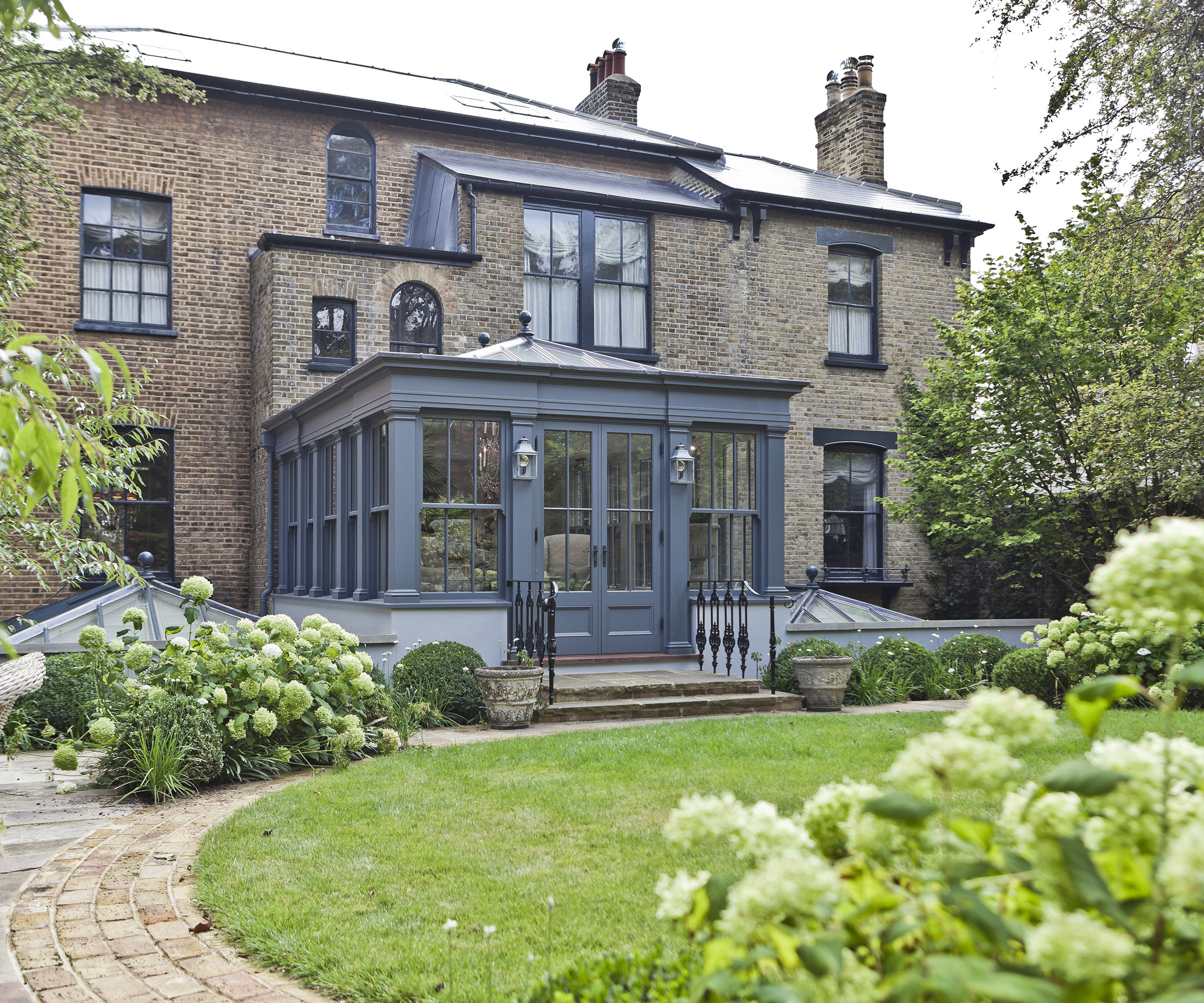 grey orangery with extension above