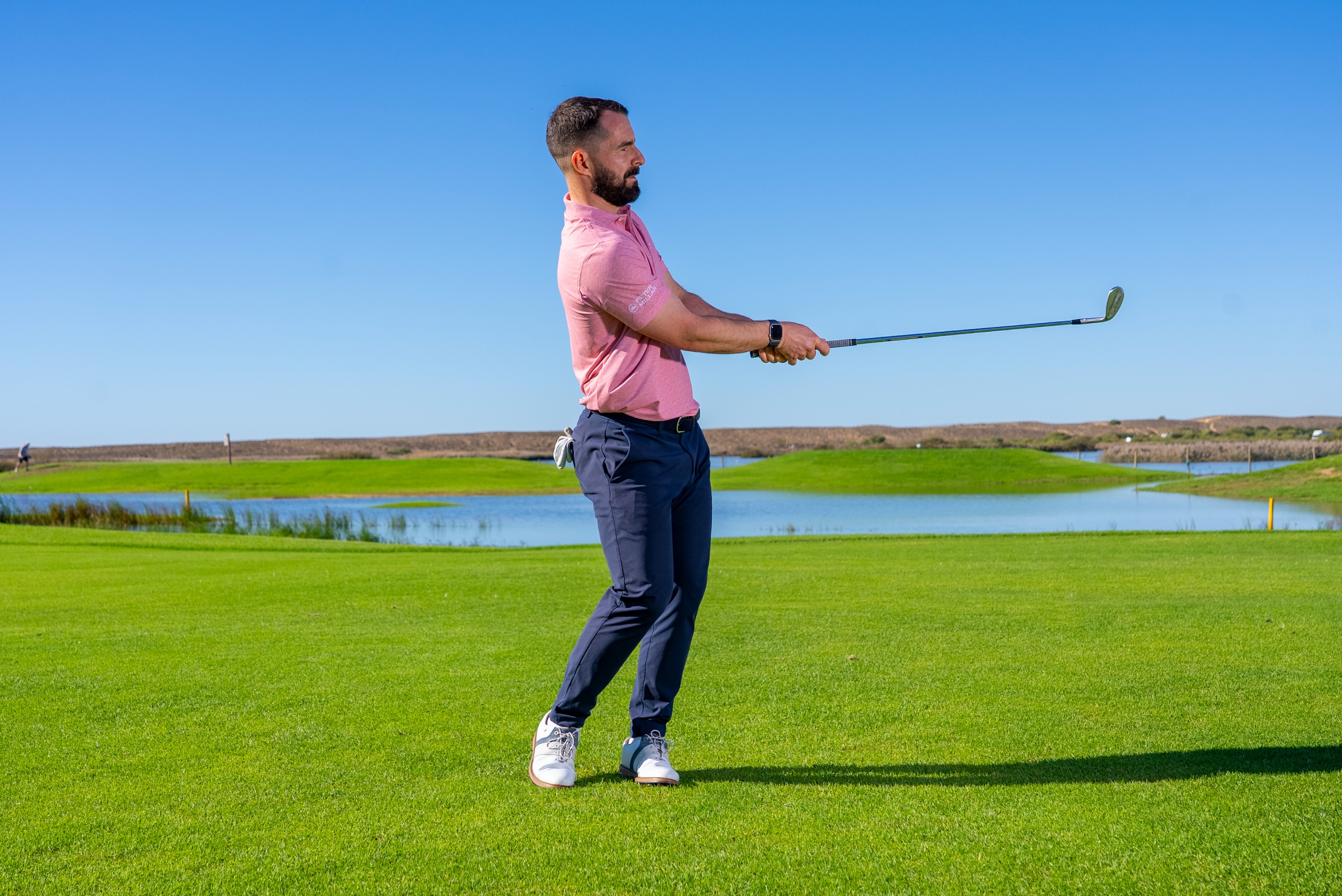 James Jankowski demonstrating how a pitch shot feeling can help control your low point with longer clubs