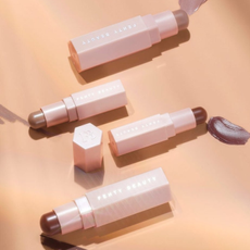 A selection of different shades of Fenty Beauty products