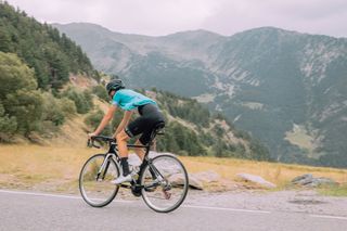 Male cyclist riding hard