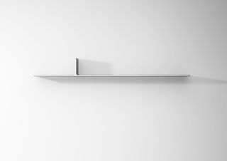 A close-up of a shelf c. 50cm wide with a small divider on top.