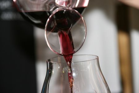 wine being poured from a decanter