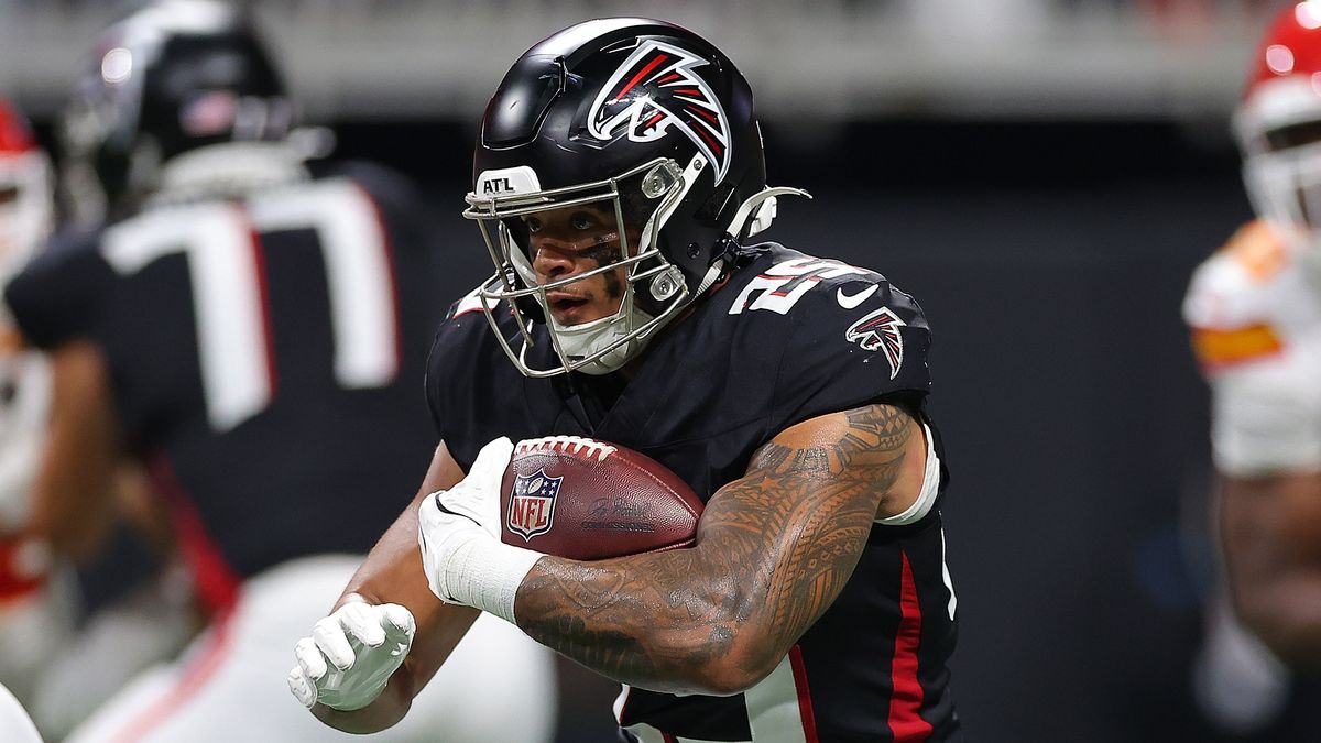 Tyler Allgeier #25 of the Atlanta Falcons rushes the field ahead of the Falcons vs Saints live stream