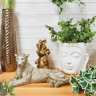 buddha head plant pot with leopard and elephant statue