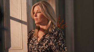 Laura Wright as Carly looking out of a window in General Hospital