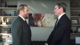 josh mcdermitt and stephen amell smiling on suits l.a.