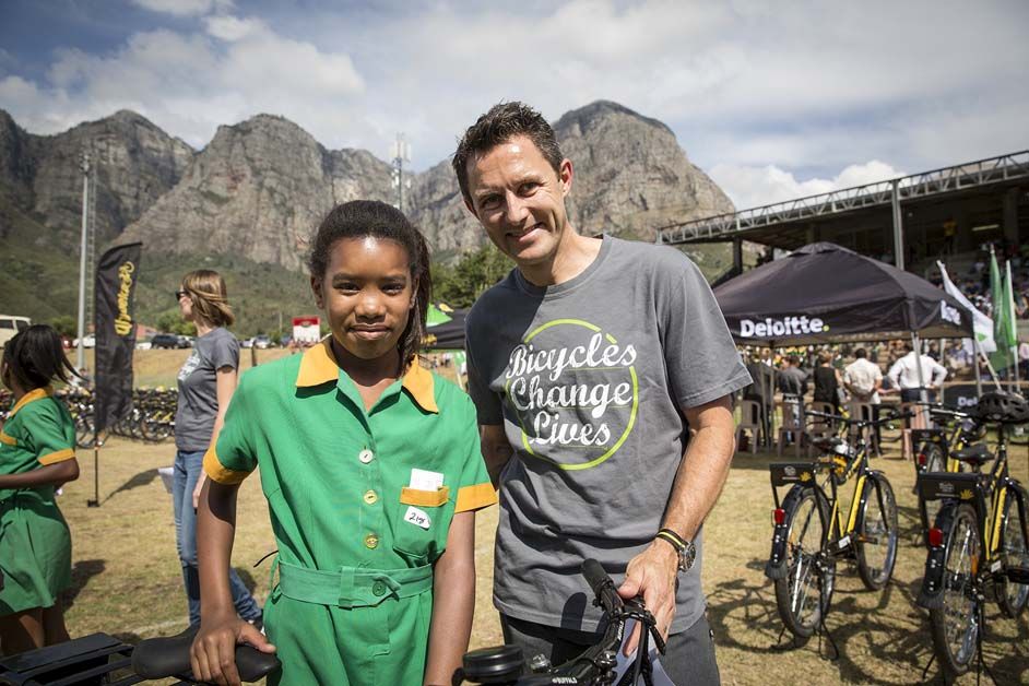 Team manager Doug Ryder with one of the children