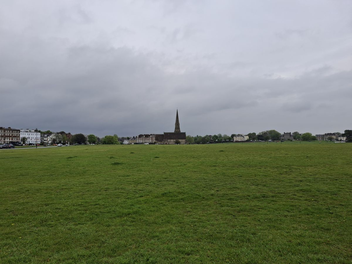 A field with a church taken on the Samsung Galaxy A35