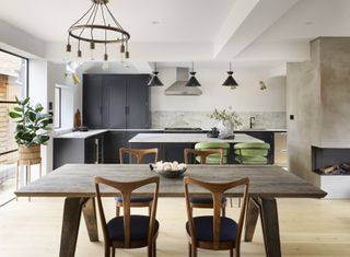 a kitchen with a fireplace for extra heating