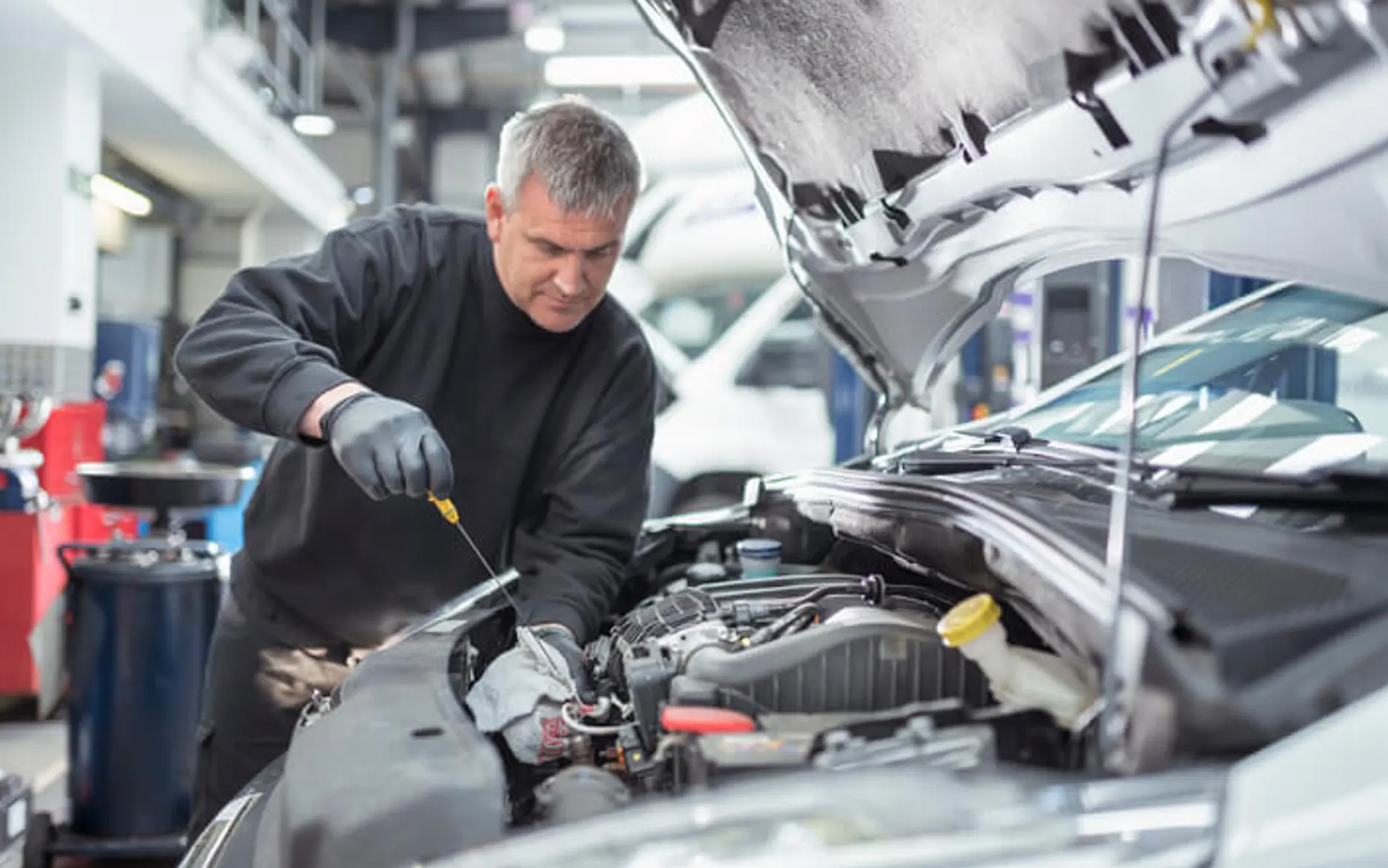 Mechanic working on a car engine