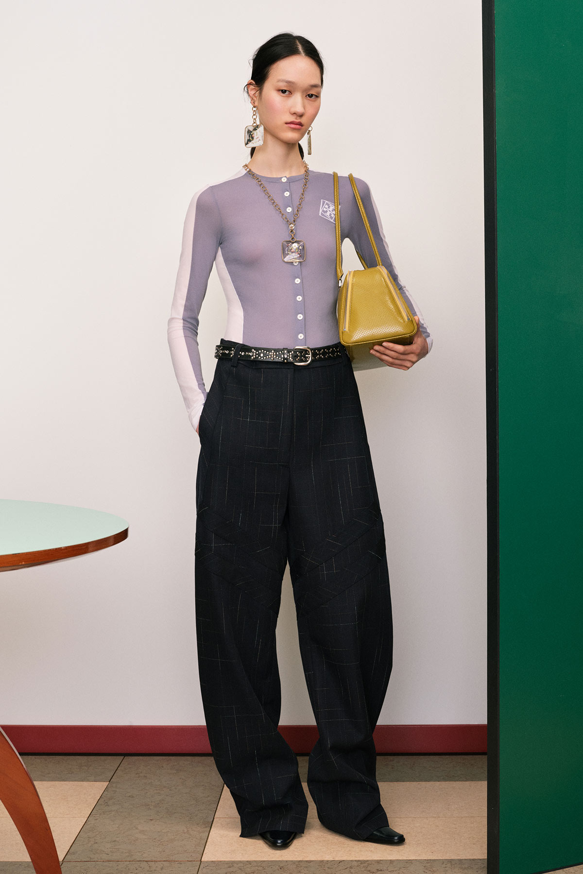 A model wearing a look from the Tory Burch Resort 26 collection