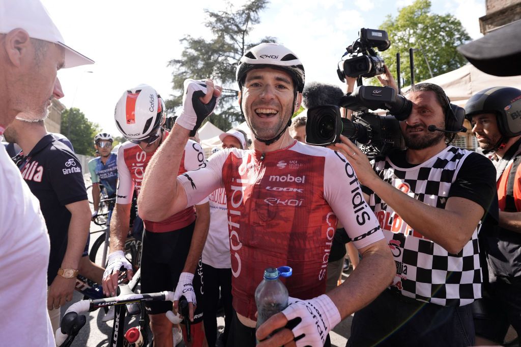 Team Cofidis' French rider Benjamin Thomas (C) celebrates after crossing the finish line to win the 5th stage of the 107th Giro d'Italia cycling race, 178 km between Genova and Lucca, on May 8, 2024 in Lucca. Team Cofidis' French rider Benjamin Thomas won the stage ahead of Team EF Education's Danish rider Michael Valgren, second, and Team Polti-Kometa's Italian rider Andrea Pietrobon, third. (Photo by Fabio FERRARI / POOL / AFP)