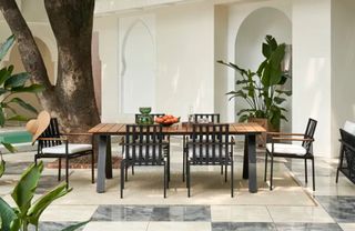 An outdoor dining table and chairs