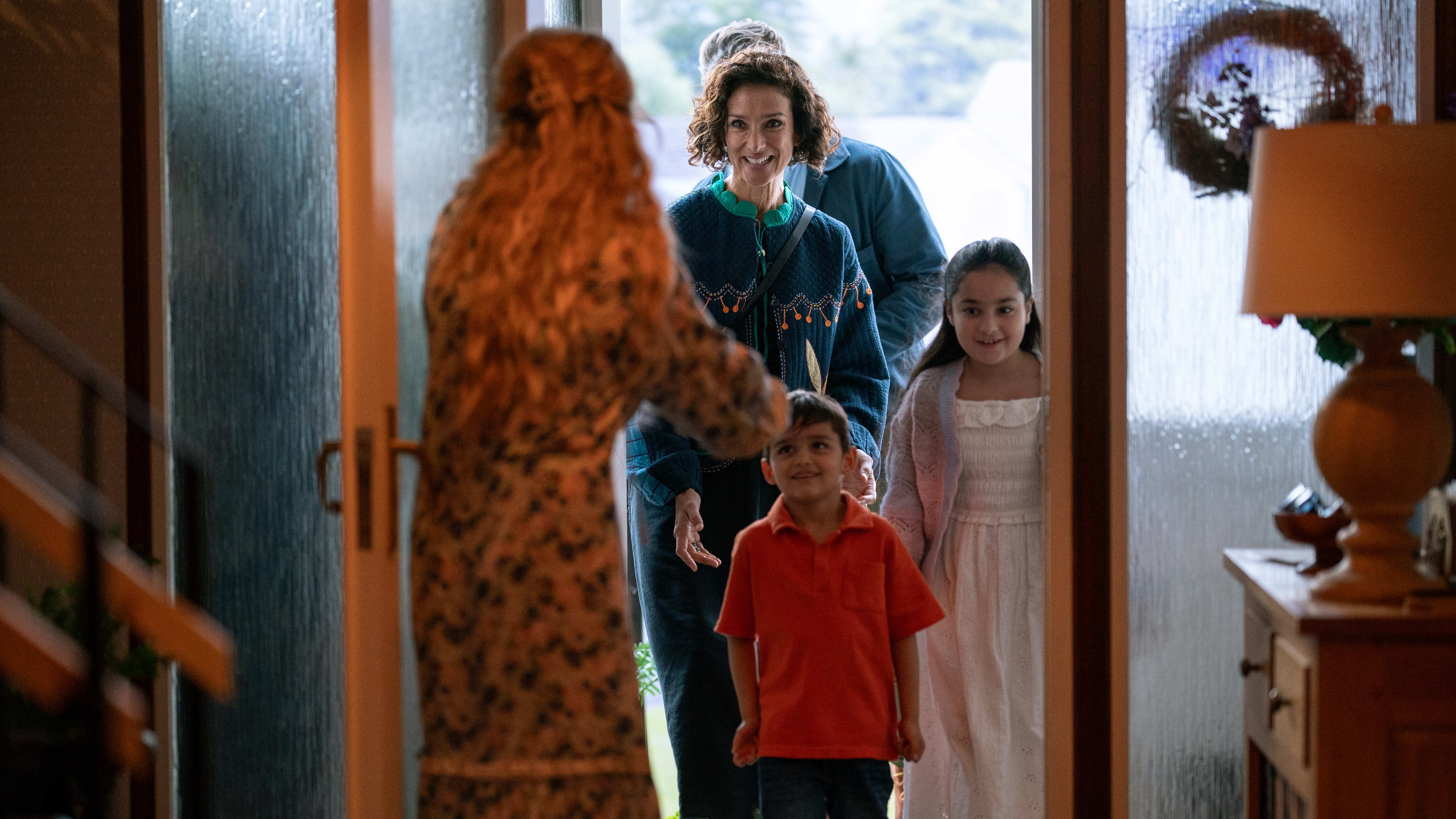 Fiona (Indira Varma) is greeted by Rebecca (Eve Myles)