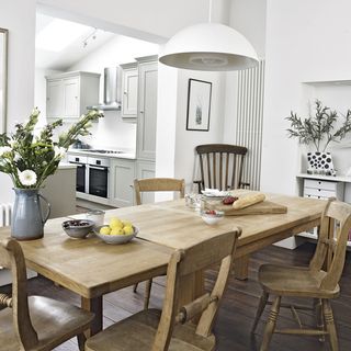 kitchen and dining room with white walls