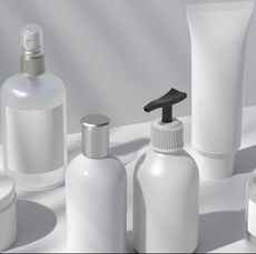 cosmetic bottles set with liquid, spray tube cream, gel, lotion set of beauty product packages 3d illustration