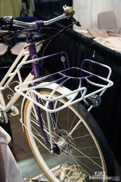 Look familiar? This front rack design is a further evolution of the sunflower bike Yipsan did last year, this time painted in purple and white and sporting a few additional details.