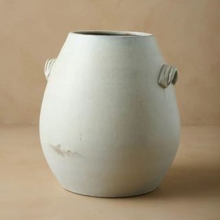 A wide Magnolia vase with handles and some distress to the paintwork