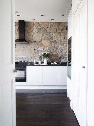 Stripped back stonework is a feature in Michelle Chian and Ross Jones' apartment