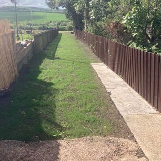garden decking area with brown fence