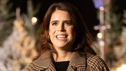 Princess Eugenie smiles at the Christmas carol concert