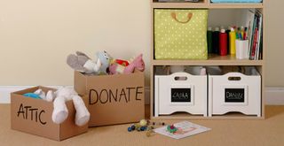 boxes next to a shelves full of items to donate or store in the attic to help bring positive energy into a home