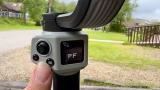 Zhiyun Cinepeer Weebill 3E gimbal close up being operated by a person's hand