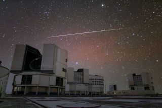 A satellite flare lights up the sky over the European Southern Observatory's Very Large Telescope (VLT) array on Paranal mountain in Chile in this sparkling image by ESO photo ambassador Roger Wesson. The four main unit telescopes that make up VLT are pictured here. Not pictured are the array's four smaller auxiliary telescopes.