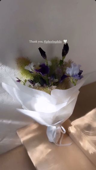 a fresh flower arrangement encased in white paper