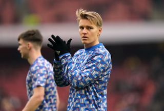 Arsenal’s Martin Odegaard warms up before the Premier League match at the Emirates Stadium, London. Picture date: Sunday January 23, 2022