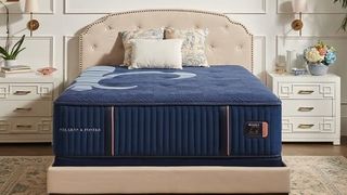 A Stearns & Foster mattress on a bed frame in an ornate bedroom