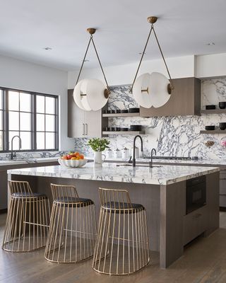 a modern kitchen with marble countertops