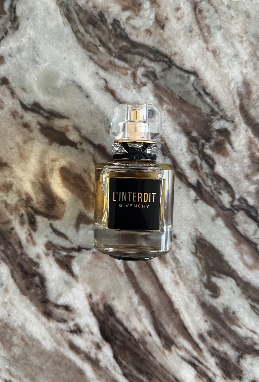 A photo of Givenchy L'Interdit Parfum on a marble table