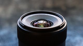 A close up of the top of the sony E 11mm f/1.8 lens